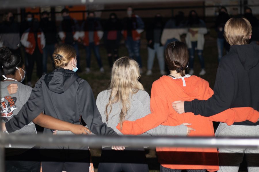 Seniors gather together in the pit to sing "I hate a hog". The tradition for bacon fry started from the Arkansas V. Texas game.