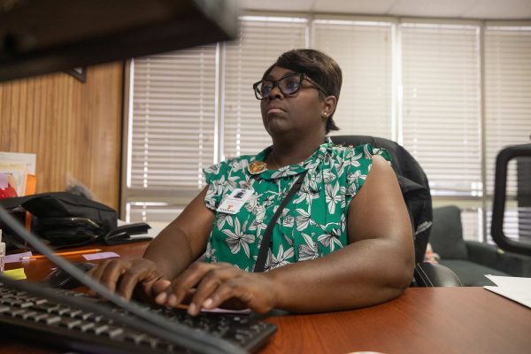 On Thursday, August 22, 2024, Settling into the new culture, Assistant principal Theresa Knight-Allen types on her computer. Knight-Allen transitioned from Westlawn Elementary to Texas High School, taking the science department and other avenues under her wing.