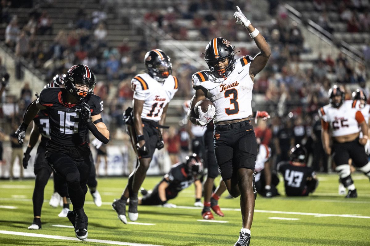 Junior Tadarian Ball runs with the ball at the end of a play. The Texas Tigers played Tyler Leagacy on Aug. 29, 2024