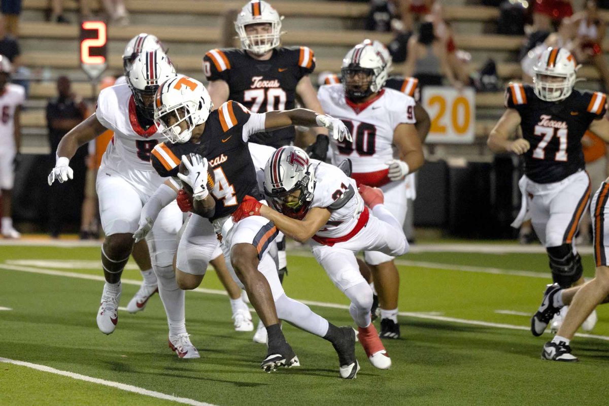 Javari Johnson drags Tyler Legacy player while rushing in the 37-13 victory on Aug. 29, 2024. 