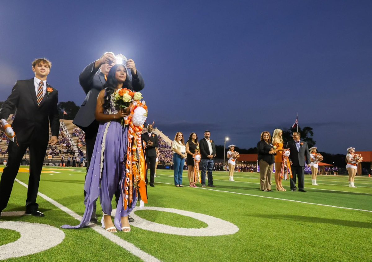 Senior Tulsi Patel receives her crown for being named homecoming queen. On Sept. 27, 2024 Texas High held their annual homecoming crowning before the game at Tiger Stadium at Grim Park.