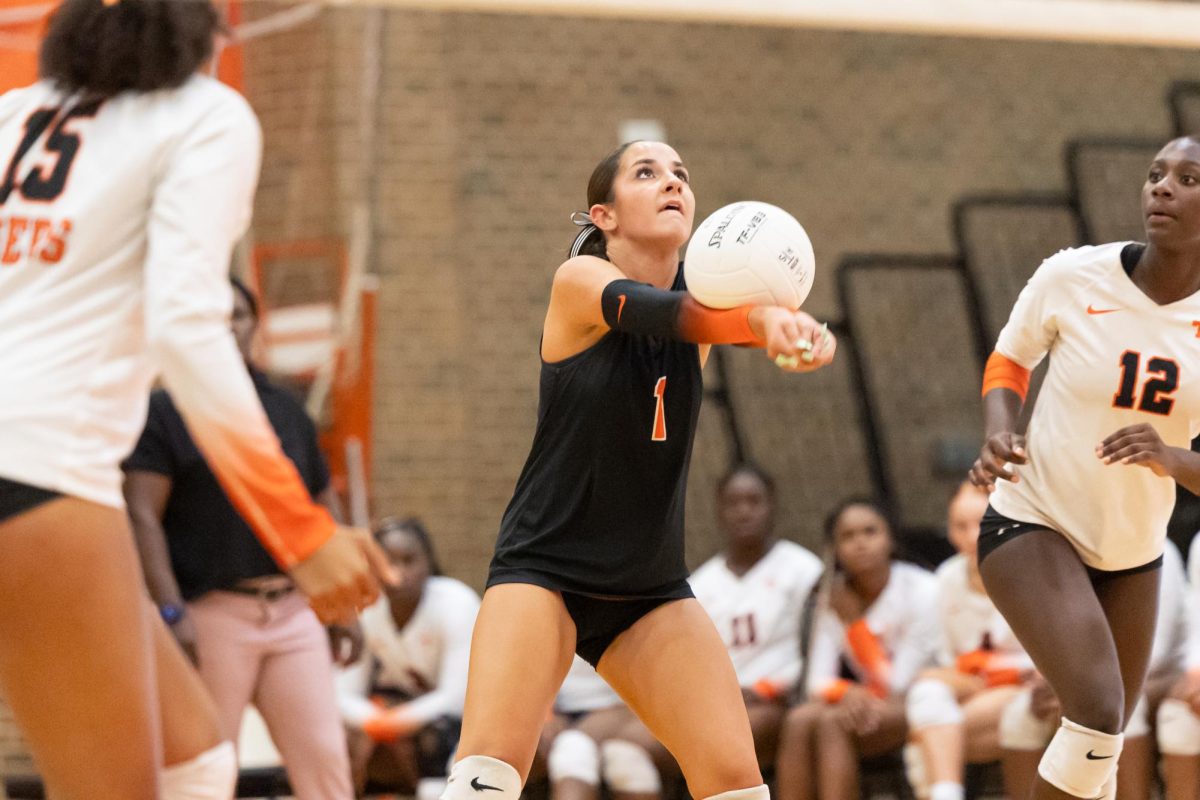 Senior Carlyn Clack hits a ball sent over from Lufkin. The Lady Tigers fought a long 4-set battle against Lufkin, ultimately ending in a defeat. 