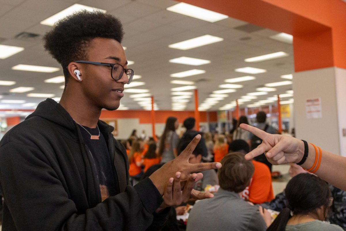 Coming to a draw at his first attempt, senior Christian Adams plays a round of Rock-Paper-Scissors for his opponents wristband. On Sept. 6, 2024, Texas High students participated in the Leader-In-Me Rock-Paper-Scissors tournament,  aimed at improving school culture. 