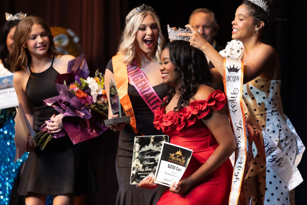 2023 Miss THS Cassidy Grant places the new crown on the winner of the 2024 Miss THS Pageant Scholarship Pageant, Hannah White at the Sullivan Performing Arts Center on Oct. 12, 2024. Olivia Dowd won first runner-up and Taliyah Gilmore won the talent competition.