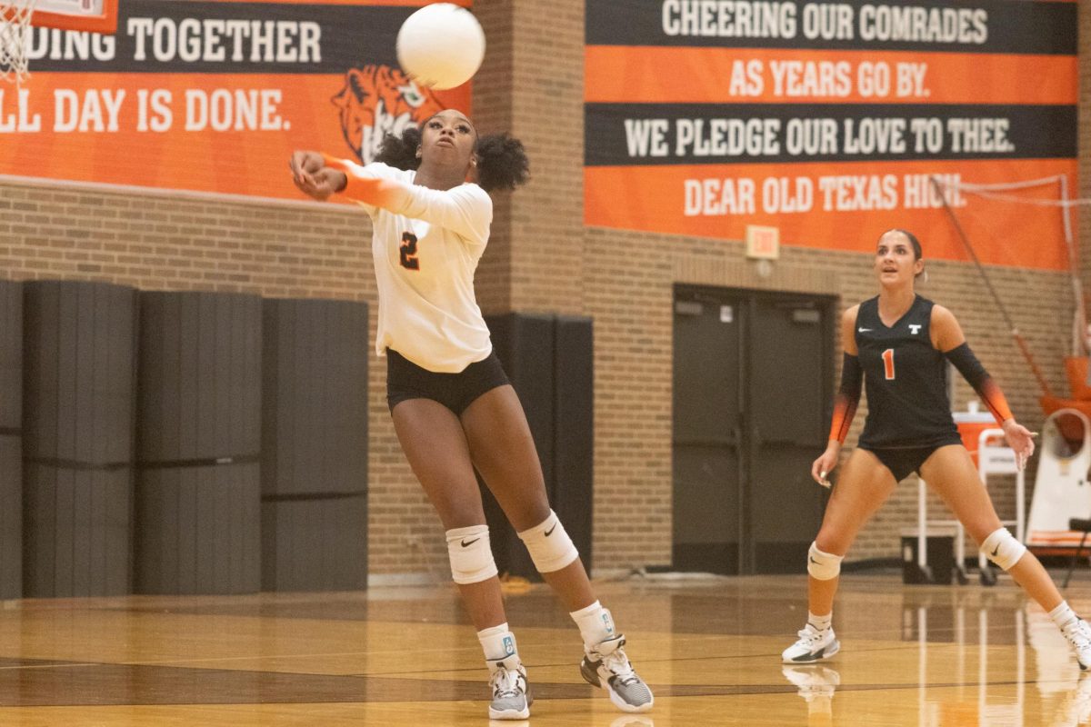 Junior Kylie Perkins hits ball back to the opposing team. The Texas Tigers played against the Lufkin Panthers Oct. 27, 2024