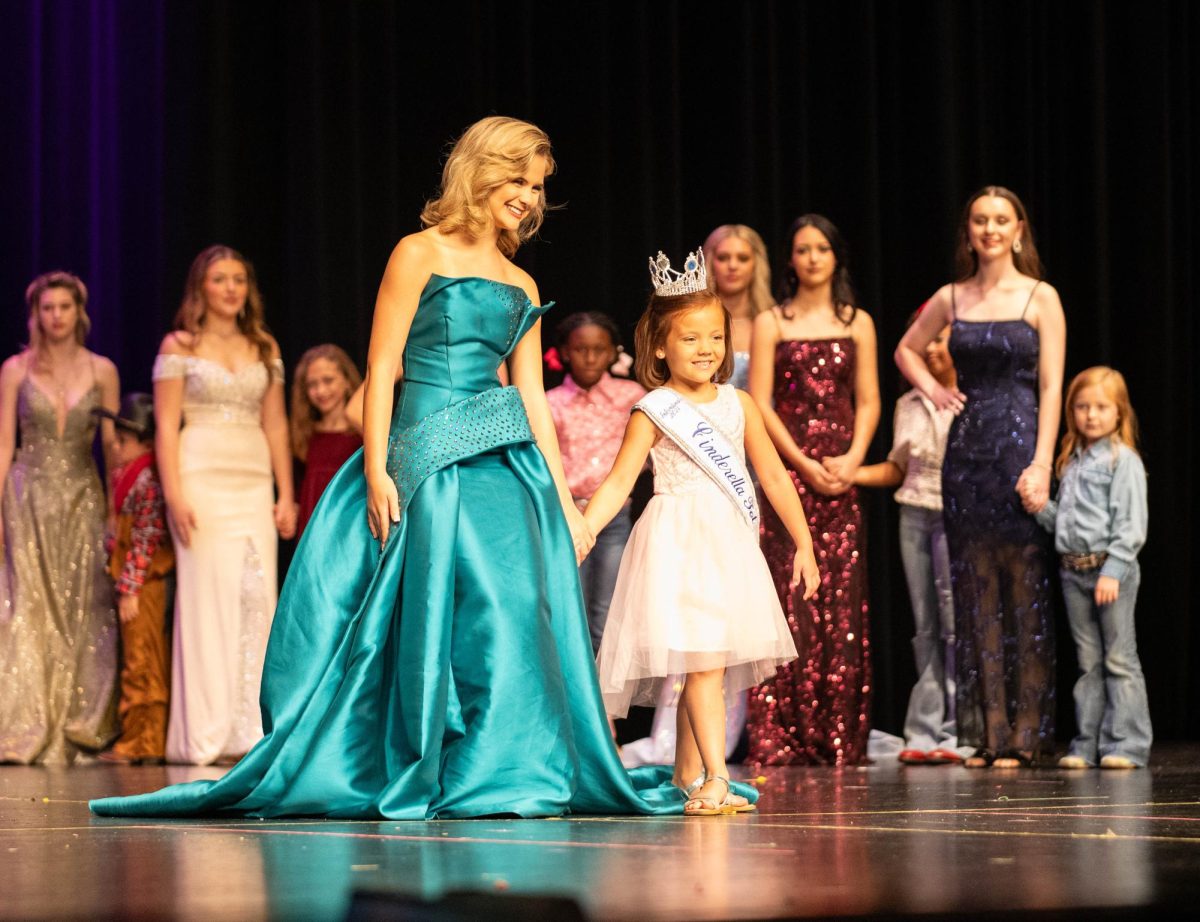 Sophomore Claire Hodge poses with aspiring pageant contestant on stage at the 2023 Miss THS Pageant. The next pageant will take place on Oct. 12 2024, in the Sullivan Preforming Arts Center. 