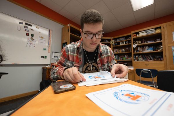 Model UN President, Hudson Reed, brands documents in preparation for an upcoming trip. On Nov. 7, 2024, Model UN departed from Texas High to a conference in Houston Texas. 