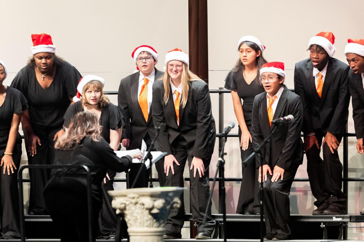 Sophomore Jillian Brimm smiles during rehearsals for Choirs upcoming Christmas concert. On Dec. 12, 2024 Texas High held the annual Christmas Choir Concert at the Sullivan Preforming Arts Center.