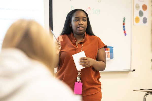 Standing up in front of one of her health science classes, Kamryn Hamilton teaches. Previously a NICU nurse, Hamilton transitioned to teaching at Texas High in hopes of inspiring students in that career field. 