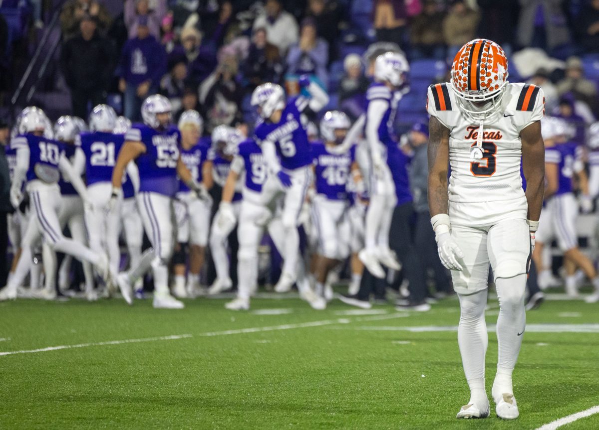 Tradarian Ball exits the field for the last time in the 2024 football season as the Port Neches-Groves fans and players celebrate a turnover on downs in the last minutes of the 5A Division II playoff game on Nov. 22, 2024. Texas High led the entire game until late in the fourth quarter when PNG scored the final touchdown to win with a score of 31-28.