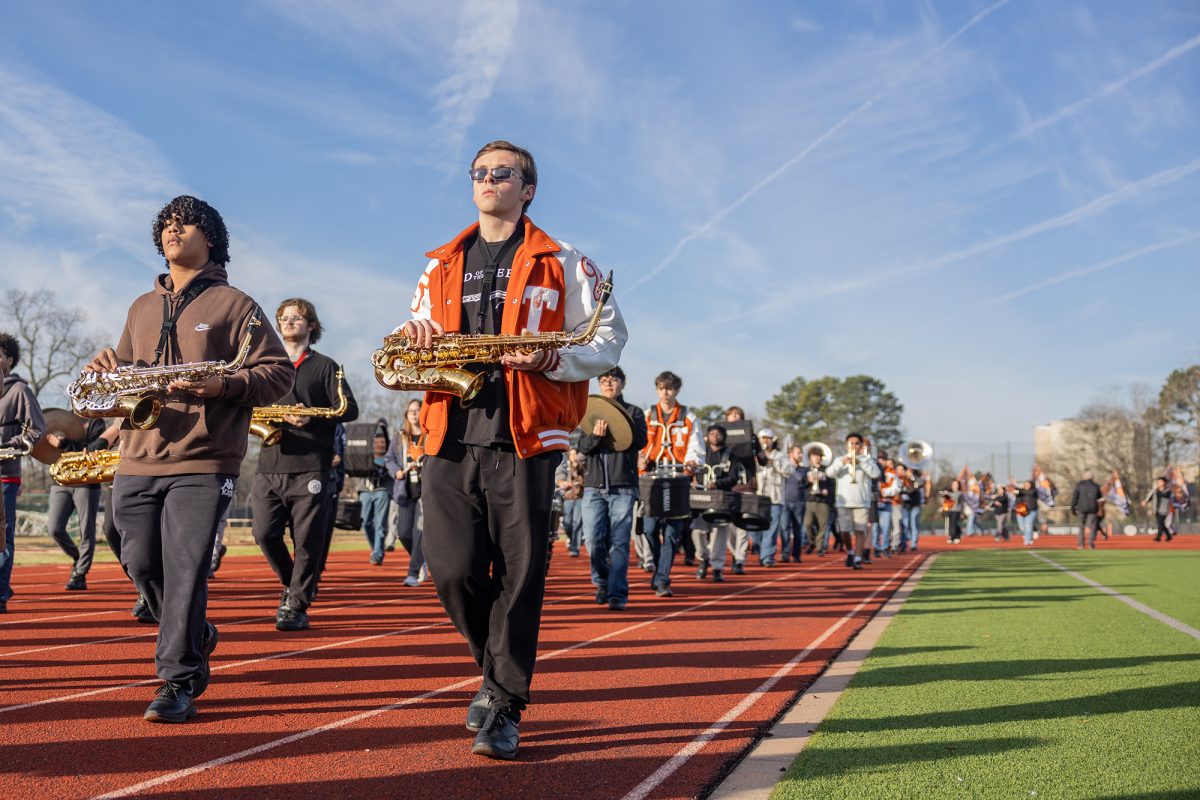 With the Tiger Band marching in unison behind him,  senior Ryker Meadows  practices the route march for the Presidential Inaguration Parade on Jan. 20, 2025 in Washington, D.C.  The Tiger Band is one of only a handful of high school bands asked to participate in the parade and the only high school from Texas.