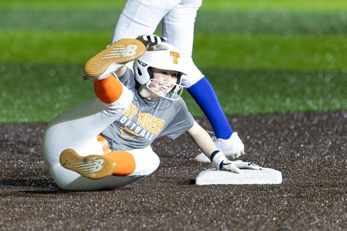 Junior Kate Cook slides past second in the Tigers scrimmage against the Hooks Hornets feb. 3, 2025.