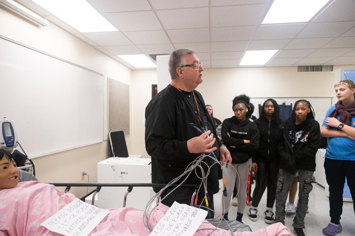 Health science teacher Joe Nolen stands at thee front of the class as he presents what his class has to offer in front of s group of eight graders. 