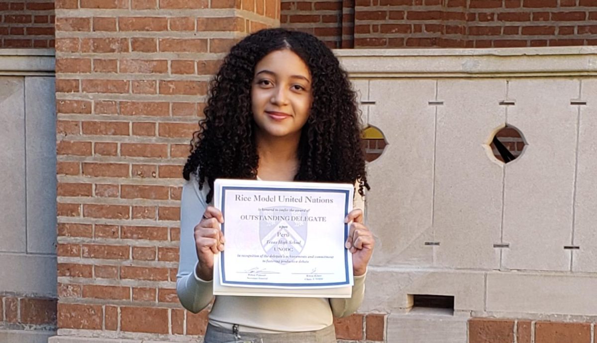 Sophomore Camila Lusinchi smiles as she poses with her Outstanding Delegate Award. On March 1, 2025, Texas High's Model UN attended team attended the Fourth Annual Model UN Conference at Rice University.