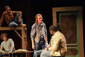 Junior Ethan Collinsworth, playing Curley, stands on stage as he intimidates Lennie in the play, "Of Mice and Men". Just two weeks before their UIL One Act Play competition on March 14, 2025, the Tiger Theatre Company switched shows to "Peter and the Starcatcher". 