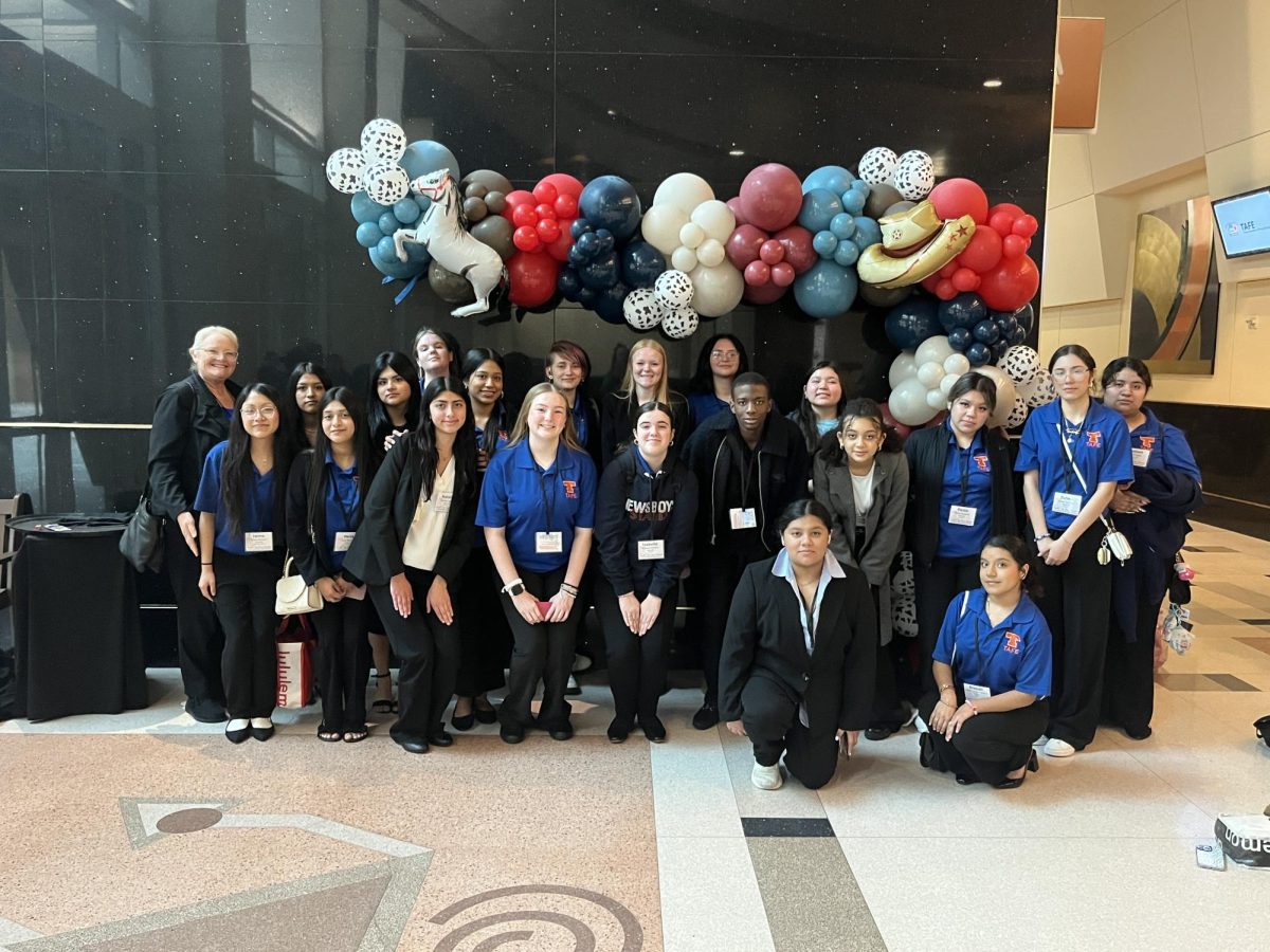 SUBMITTED PHOTO: Posed together in a group, members of the Texas Association of Future Educators smile at the state conference in Galveston, Texas. Twenty-two members advanced to state and three emerged national qualifiers.